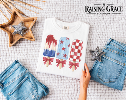 Patriotic Popsicle Shirt | Coquette Bow 4th of July Tee | Red White Blue Summer Graphic Tee | Cute Americana Shirt | Women's Boutique Tee